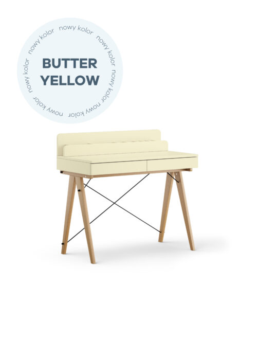 Dziecięce biurko z szufladami i pionową nadstawką w kolorze masełkowym na drewnianych nóżkach